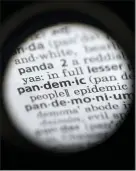  ??  ?? In this photo taken through a camera lens, the word “pandemic” in seen in a dictionary in Washington.