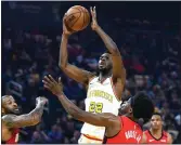  ?? DOUG DURAN — BAY AREA NEWS GROUP ?? Golden State Warriors’ Andrew Wiggins (22) takes a shot as Houston Rockets’ Danuel House (4) tries to block in the first period of their basketball game at the Chase Center in San Francisco on Thursday.