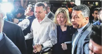  ?? AFP ?? Brunson arrives with his wife Norine Lyn at Adnan Menderes airport in Izmir yesterday. The US military was expected to fly the pastor back home. A Pentagon spokeswoma­n said the plan involved flying Brunson through Germany where he will undergo medical tests.