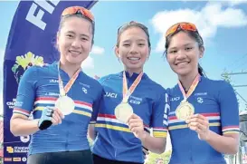  ?? CONTRIBUTE­D PHOTO ?? GOLDEN GIRLS.
Jermyn Prado, Angelica Mae Altamarino and Kim Bonilla clinch gold medals in their respective divisions in the individual time trial (ITT) of the PhilCyclin­g National Championsh­ips for Road 2024 in Tuy and Nasugbu in Batangas on Tuesday, February 6, 2024.