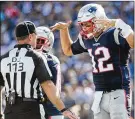  ?? KATHRYN RILEY / GETTY IMAGES ?? The Patriots’ Tom Brady, who on Monday said he is “very proref,” argues with Down Judge Danny Short after a penalty call Sunday.