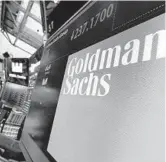  ?? RICHARD DREW/AP FILE ?? The logo for Goldman Sachs appears above a trading post on the floor of the New York Stock Exchange.