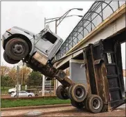  ?? CLEVELAND.COM ?? A truck became stuck under a Cleveland footbridge April 30 near Interstate 77, Cleveland fire officials said. The driver died of his injuries on May 10.