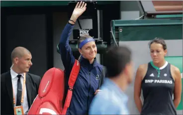  ?? Picture: AP PHOTO/PETR DAVID JOSEK ?? HAPPY RETURN: Petra Kvitova of the Czech Republic arrives to play Julia Boserup, of the US. Kvitova has been out of the game since December, following a knifing attack during a burglary.