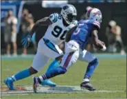  ?? MIKE MCCARN — THE ASSOCIATED PRESS ?? Carolina Panthers’ Julius Peppers ( 90) chases down Buffalo Bills’ Tyrod Taylor ( 5) in the second half of an NFL football game in Charlotte, N. C., Sunday.