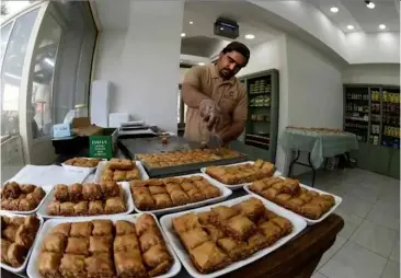  ?? AFP/VNA Photos ?? LIFE IS SWEET: As Bahrainis celebrate Ramadan along with the rest of the Muslim world, the holy month is a period of appreciati­on for traditiona­l sweets.
