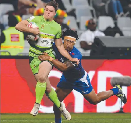  ?? Picture: GETTY IMAGES ?? Bond University recruit Connor Pritchard on the attack for the Zimbabwe Sevens team.