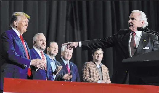  ?? Matt Rourke
The Associated Press ?? South Carolina Gov Henry Mcmaster, right, pointing towards Republican presidenti­al candidate and former President Donald Trump, left, during a campaign event in Manchester, N.H., on Saturday.