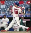  ?? LAURENCE KESTERSON — AP ?? The Philadelph­ia Phillies’ Andrew Knapp (15) follows through on a walkoff home run in the 13th inning of a baseball game against the Washington Nationals, Sunday in Philadelph­ia.