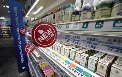  ?? AP FILE ?? HEALTH BOOST: Signs advertise new products at a CVS store with the new HealthHUB in Spring, Texas.