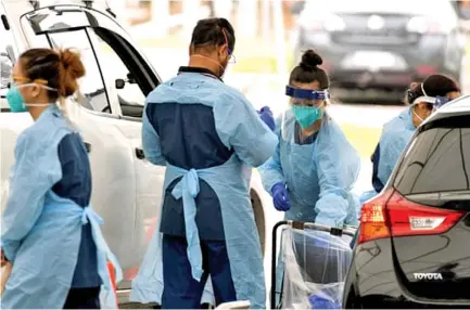  ?? Photo: Reuters ?? COVID-19 testing facilities and hospitals in NSW are under severe strain amid rising cases and staff furloughs.
