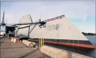  ??  ?? Another attempt to cut back on munitions costs involves the Navy’s stealthy new destroyer, the Zumwalt.