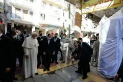  ??  ?? Pope Francis arrives for his meeting with grand ayatollah Ali al-Sistani