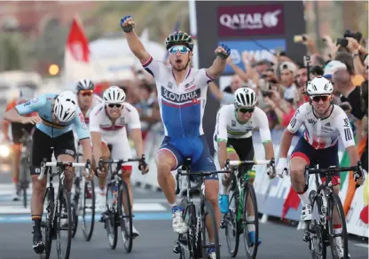  ?? — AFP ?? DOHA: Slovakia’s Peter Sagan celebrates after winning the men’s elite road race event as part of the 2016 UCI Road World Championsh­ips yesterday, in the Qatari capital Doha.