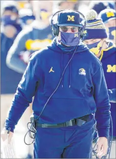  ?? Carlos Osorio The Associated Press ?? Michigan coach Jim Harbaugh, in the last year of his contract, has started losing two of three games, including one to intrastate rival Michigan State.