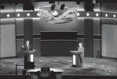  ?? AP/MARY ALTAFFER ?? Republican presidenti­al nominee Donald Trump and Democratic presidenti­al nominee Hillary Clinton stand onstage during Monday night’s debate.