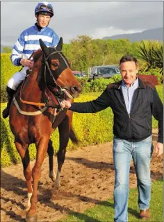  ??  ?? Ross Coakley and Total Demolition are led back to the winner’s enclosure at Killarney.