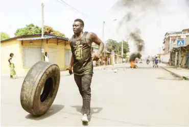  ??  ?? Protesters erected makeshift barricades and blocked roads at a demonstrat­ion last month in Lomé, Togo Yanick Folly/Agence France-Presse