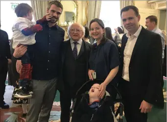  ??  ?? The Martin family from Rathnew – Les, Lynda and their sons, Cathal and Ciaran – with President Michael D Higgins and Deputy John Brady at Áras an Uachtaráin.