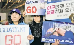  ?? AP ?? BREAKING BARRIERS: Korean fans wait for Shohei Ohtani and the Dodgers to arrive at a luncheon this weekend. Korean fans are embracing the Japanese star — which is unusual given the relationsh­ip between the nations.