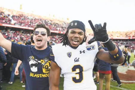  ?? Cody Glenn / Icon Sportswire via Getty Images 2019 ?? Cal defensive back Elijah Hicks celebrates with a fan after the Bears prevailed 2420 at Stanford in last year’s Big Game.