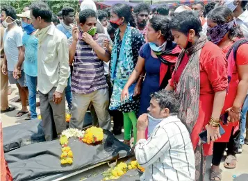  ?? — K. MURALI KRISHNA ?? Residents of RR Venkatapur­am village protest against LG Polymers by bringing bodies of Govindaraj­u, 35, Sankara Rao, 45, and Nani, after they were killed in the styrene gas leak, demanding closure of the plant in Visakhapat­nam on Saturday.