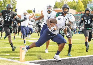  ?? JASON E. MICZEK/SPECIAL TO THE VIRGINIAN-PILOT ?? Old Dominion freshman running back Lala Davis scores his first college touchdown during the second quarter last week against Charlotte.