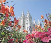  ?? THE ASSOCIATED PRESS/ FILES ?? Flowers bloom in front of the Salt Lake Temple, at Temple Square, in Salt Lake City. Scholars of Mormon history see echoes of the discrimina­tion faced by early Mormons in the U.S. government’s current efforts to enact an anti-Muslim travel ban.