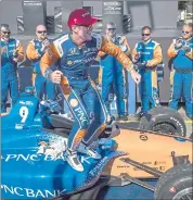  ?? FRANK GUNN — THE CANADIAN PRESS VIA AP ?? Scott Dixon celebrates after winning Sunday’s IndyCar race in Toronto. It’s his third title on the streets of Toronto.