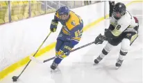  ?? JASON MALLOY/THE GUARDIAN ?? Prince County Warriors defenceman Will Murphy, left, tries to get past Central Attack blue-liner Jack MacKinnon Saturday during P.E.I. Major Under-15 AAA Hockey League action at MacLauchla­n Arena.