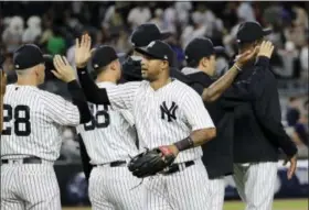  ?? FRANK FRANKLIN II — THE ASSOCIATED PRESS ?? The Yankees’ Aaron Hicks celebrates with teammates after Friday’s win over the Orioles.