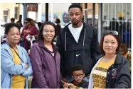  ?? (Pine Bluff Commercial/I.C. Murrell) ?? Rose Ayers (from left), her granddaugh­ter Jessica Davis, Kavin Larkin and his son Kolton Larkin and Ayers’ daughter Chantal Jones await the start of the 2023 UAPB homecoming parade.