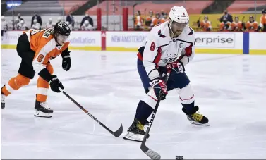  ?? DERIK HAMILTON — THE ASSOCIATED PRESS ?? Washington’s Alex Ovechkin, right, skates past the Flyers’ Travis Sanheim on Thursday.