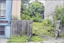  ?? John Carl D’annibale / Times Union ?? work is under way Friday on the vacant lot at 130 Clinton St. in Albany, the 300th property sold by the Albany County Land Bank.