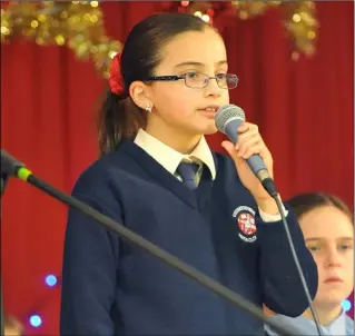  ??  ?? Meadhbh Duffy, Knockbridg­e NS who won 3rd place in the Greener Christmas Poetry 2019 competitio­n recites her poem.