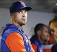  ?? THE ASSOCIATED PRESS ?? Mets pitcher Jason deGrom watches from the dugout during a game against the Nationals.