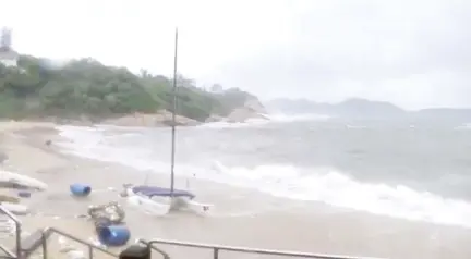  ??  ?? Still image taken from Reuters TV footage shows debris as waves crash on Shek O Beach, during Typhoon Hato in Hong Kong. — Reuters photo