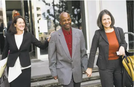  ?? James Tensuan / Special to The Chronicle ?? Ex-inmate Glenn Payne leaves San Jose’s Hall of Justice in January with members of the Northern California Innocence Project.