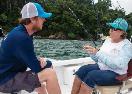  ??  ?? Capt. Richard White, Tropic Star Lodge’s director, and Terri Andrews discuss the conservati­on measures underway. They seek to minimize the ecological footprint of the lodge while ensuring great fishing.