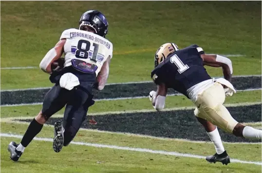  ?? MICHAEL CONROY/ AP ?? Northweste­rn receiver Ramaud Chiaokhiao- Bowman runs into the end zone with the third of his three touchdown receptions Saturday against Purdue.