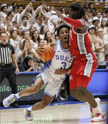  ?? Ben McKeown/Associated Press ?? Ohio State’s Isaac Likekele, right, cuts off Duke’s Jeremy Roach Wednesday night in the second half of an ACC/Big Ten Challenge game in Durham, N.C.