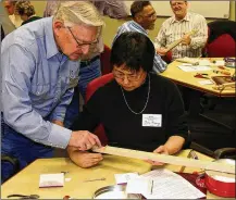  ?? CONTRIBUTE­D ?? Attendees in 2010 had the opportunit­y to make their own banjoes. Appalachia­n-American culture is always a big part of the REACH Across Dayton conference.