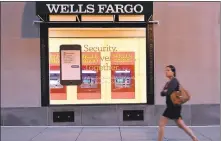  ?? AFP/GETTY IMAGES ?? Wells Fargo has increased its estimate for the amount of bogus bank accounts opened without permission from customers to 3.5 million.