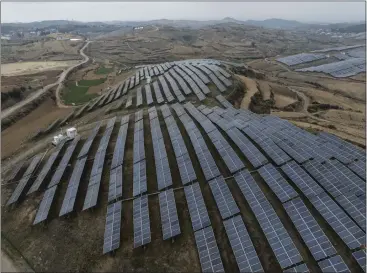  ?? GILLES SABRIE — THE NEW YORK TIMES ?? A solar farm covers a hillside in Shilin Yunnan, China, on March 1. European leaders are considerin­g imposing higher tariffs on solar panels and wind turbines from China as the country expands its exports.