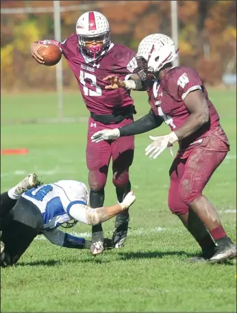  ?? Photo by Ernest A. Brown ?? Woonsocket senior Dwayne Robinson-O’Hagan (13) is on the move during Saturday’s Division II playoff game against Middletown at Barry Field. Also pictured is WHS junior Corey Brown (4).