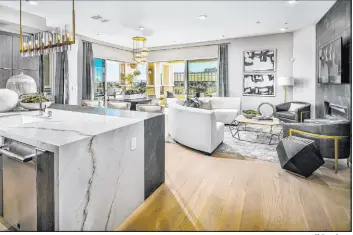  ?? Toll Brothers ?? Mira Villa by Toll Brothers, a luxury neighborho­od in the golf-themed Canyons village, features a collection of all single-story luxury condominiu­m flats housed in a mid-rise. Homes are priced from the high $900,000s to more than $2 million.