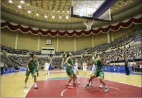  ?? KOREA POOL VIA AP ?? South and North Korean players of Team Peace, in white, and Team Prosperity play during a friendly game July 4 at Ryugyong Jong Ju Yong Gymnasium in Pyongyang, North Korea.