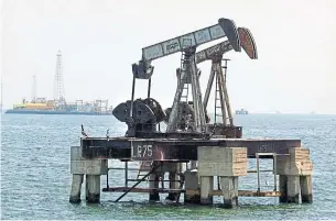  ?? JUAN BARRETO AGENCE FRANCE-PRESSE FILE PHOTO ?? U.S. oil futures have gained 26 per cent as fears of a global glut diminished. Oil got a boost this week as supplies from Venezuela tightened and Saudi Arabia continued to curb its exports.