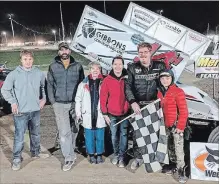  ?? MERRITTVIL­LE SPEEDWAY ?? Jim Huppenen with the checkered flag after winning the final race.