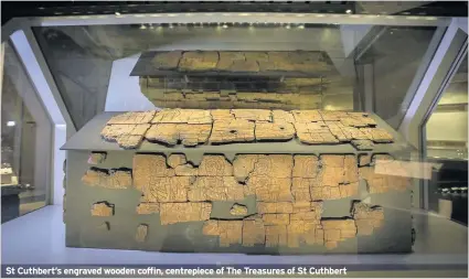  ??  ?? St Cuthbert’s engraved wooden coffin, centrepiec­e of The Treasures of St Cuthbert